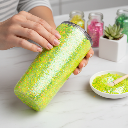 Tumbler being decorated with lemon lime glitter